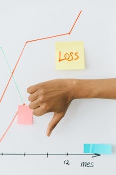 Person Holding Orange and White Sticky Note